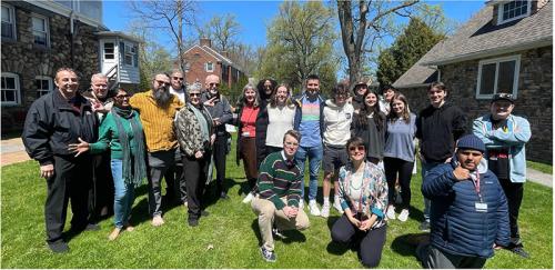 The group celebrating the Deignan Institute's Earth Day initiative.