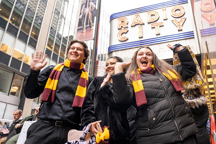 Students cheering outside of Radio City Music Hall.